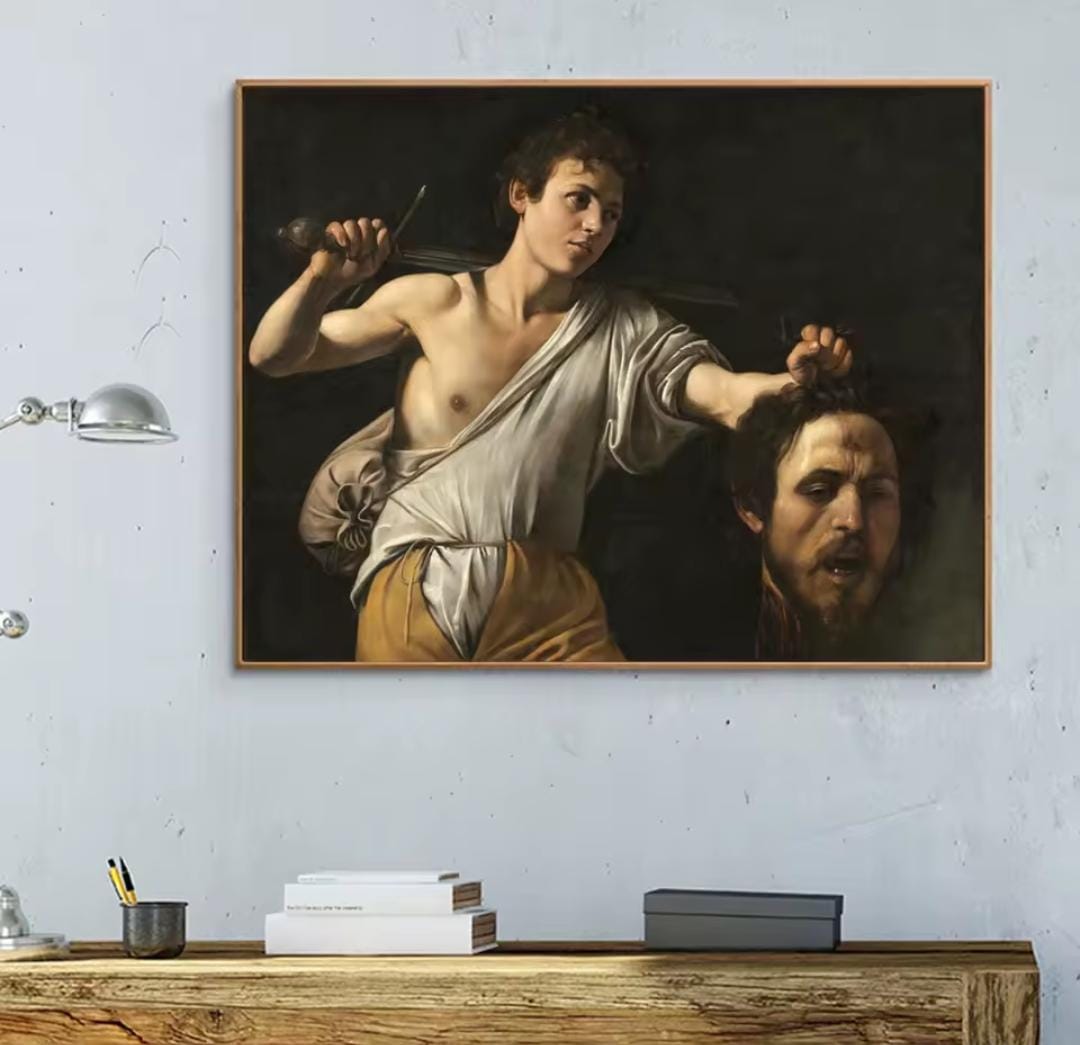 David con la testa di Golia Caravaggio: quadro arte Barocca che ritrae David che tiene la testa recisa di Golia. Stampa su tela capolavoro classico caratterizzata dal potente chiaroscuro.