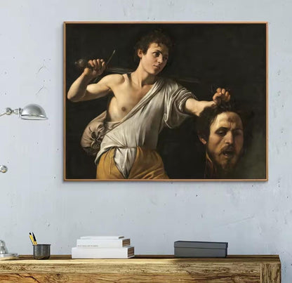 David con la testa di Golia Caravaggio: quadro arte Barocca che ritrae David che tiene la testa recisa di Golia. Stampa su tela capolavoro classico caratterizzata dal potente chiaroscuro.