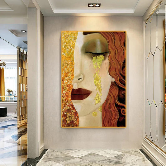 Quadro “Le Lacrime di Freyja – Anne Marie Zilberman”: volto femminile malinconico con lacrime in tonalità oro e azzurro su tela.