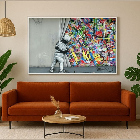 Quadro “Street Art di Banksy”: bambino che srotola una tenda rivelando graffiti colorati dietro il muro, stampa su tela.