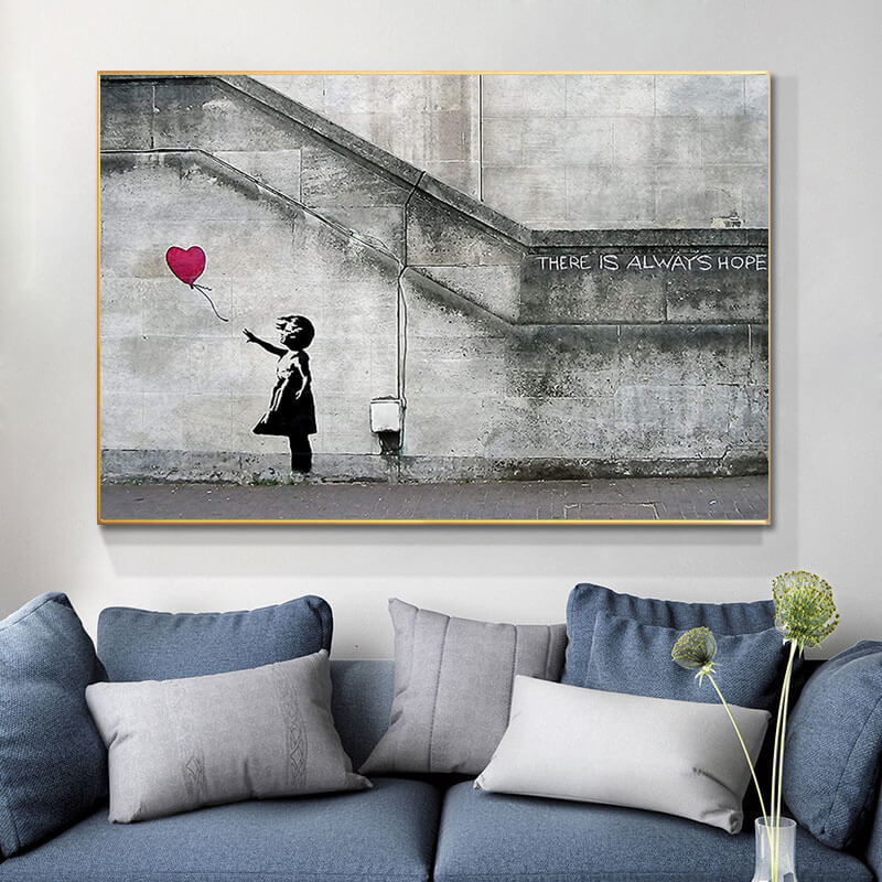 Quadro Bambina con Palloncino di Banksy, un'opera d'arte urbana che rappresenta un momento di innocenza e speranza, ideale per spazi creativi e riflessivi.