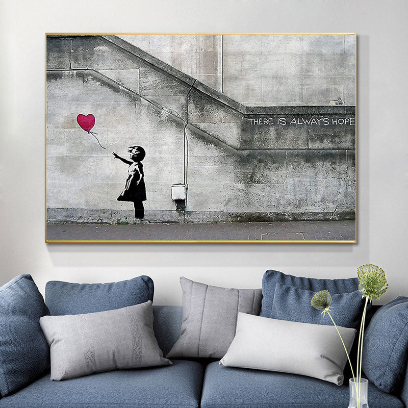 Quadro Bambina con Palloncino di Banksy, un'opera d'arte urbana che rappresenta un momento di innocenza e speranza, ideale per spazi creativi e riflessivi.